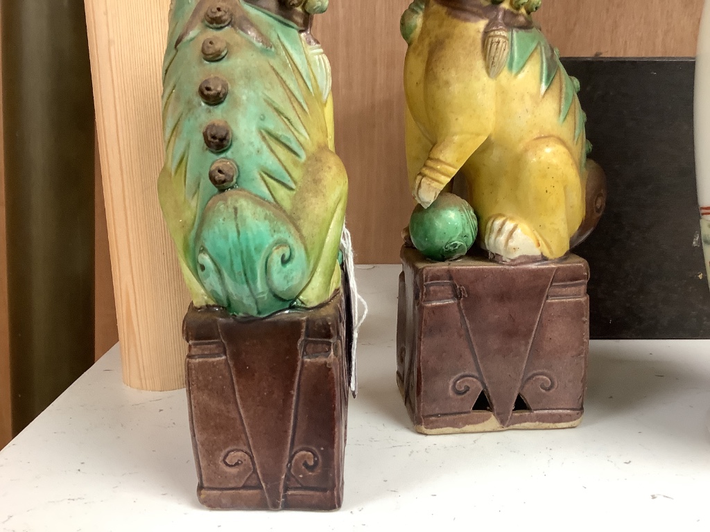 A pair of Chinese lion-dogs dogs, porcelain bowl and a vase, tallest 24cm